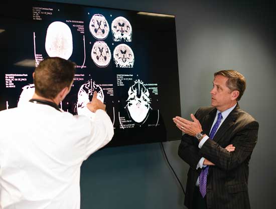 Attorney Mark Dix reviewing x-rays with medical professional